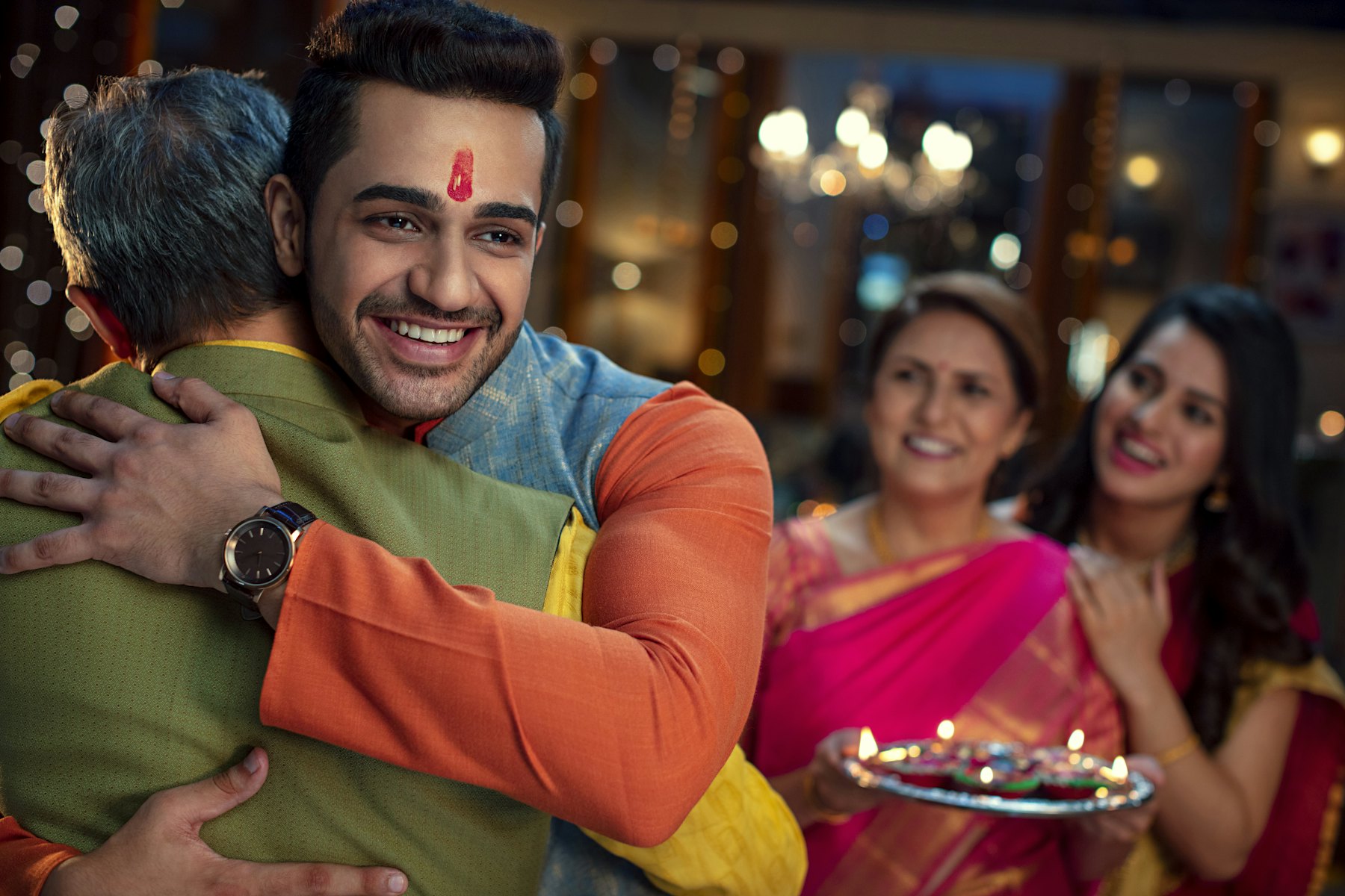 Father and son embracing during a family celebration
