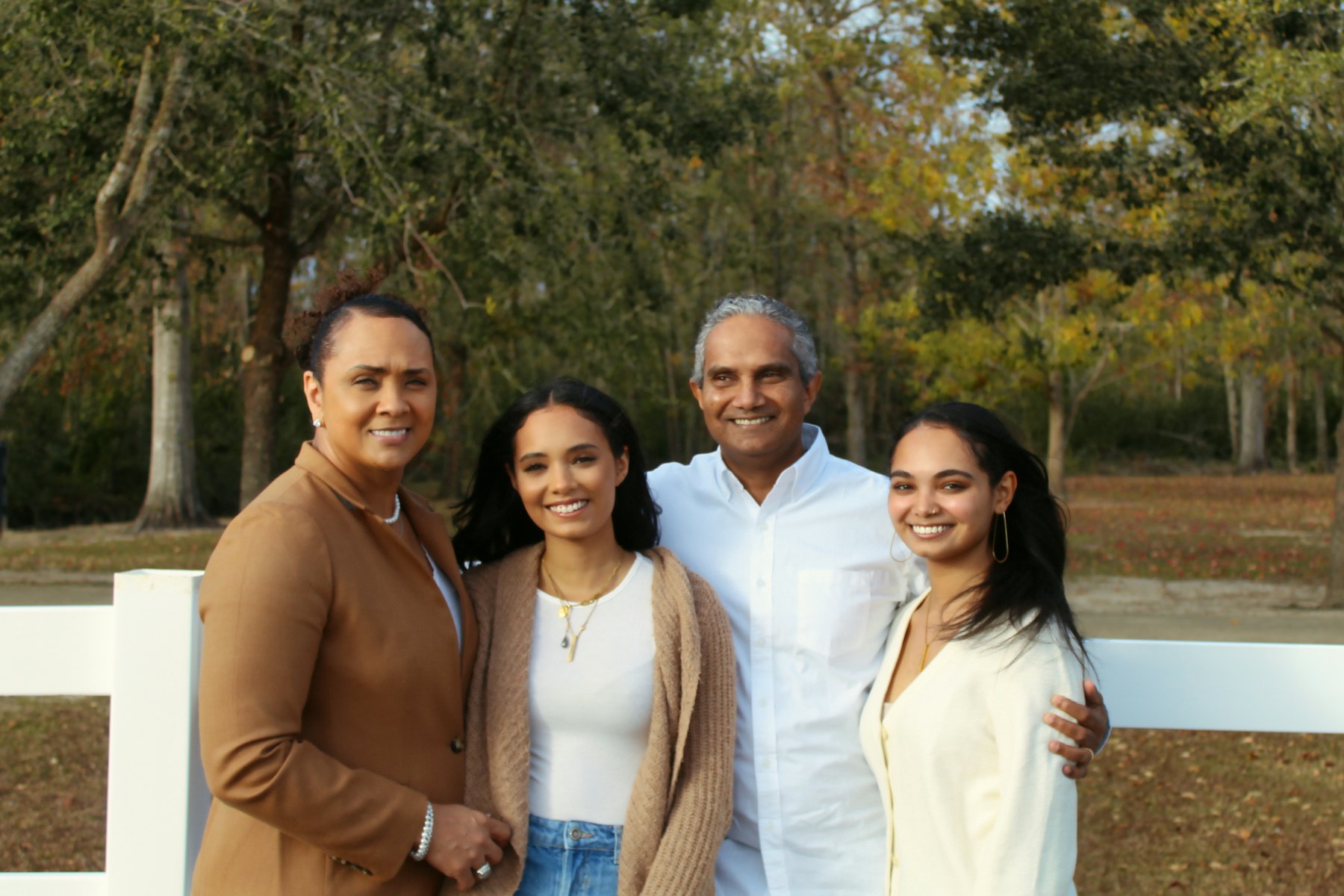 Multi-generational family smiling together in a garden