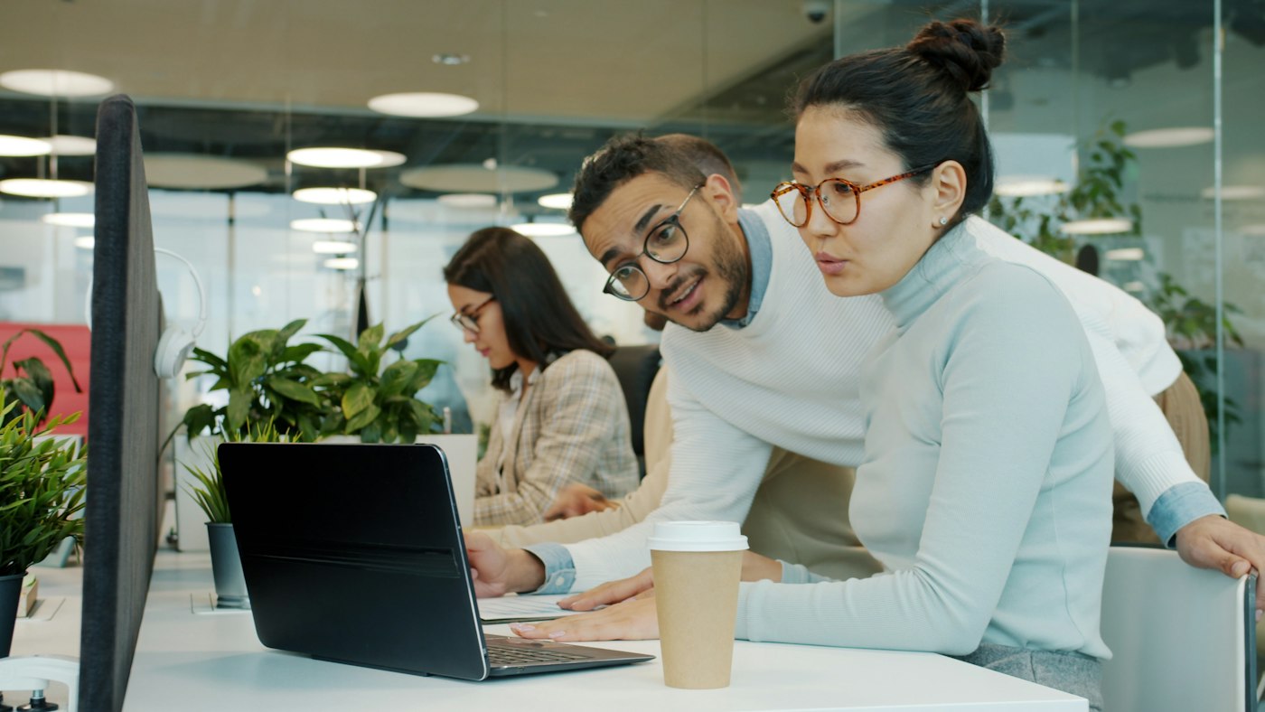 Estate planners working together on a laptop in the office