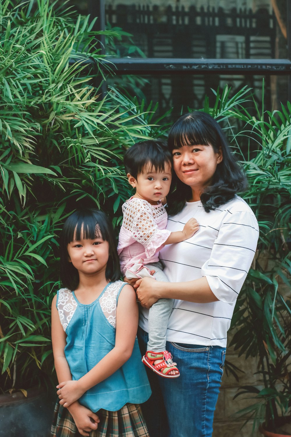 Mother with her two daughters, protected by a family trust