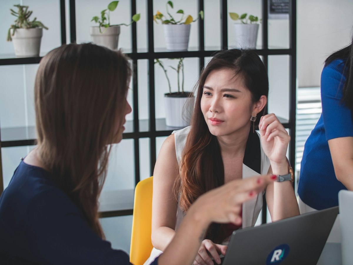 Estate planners discussing a client plan in the office